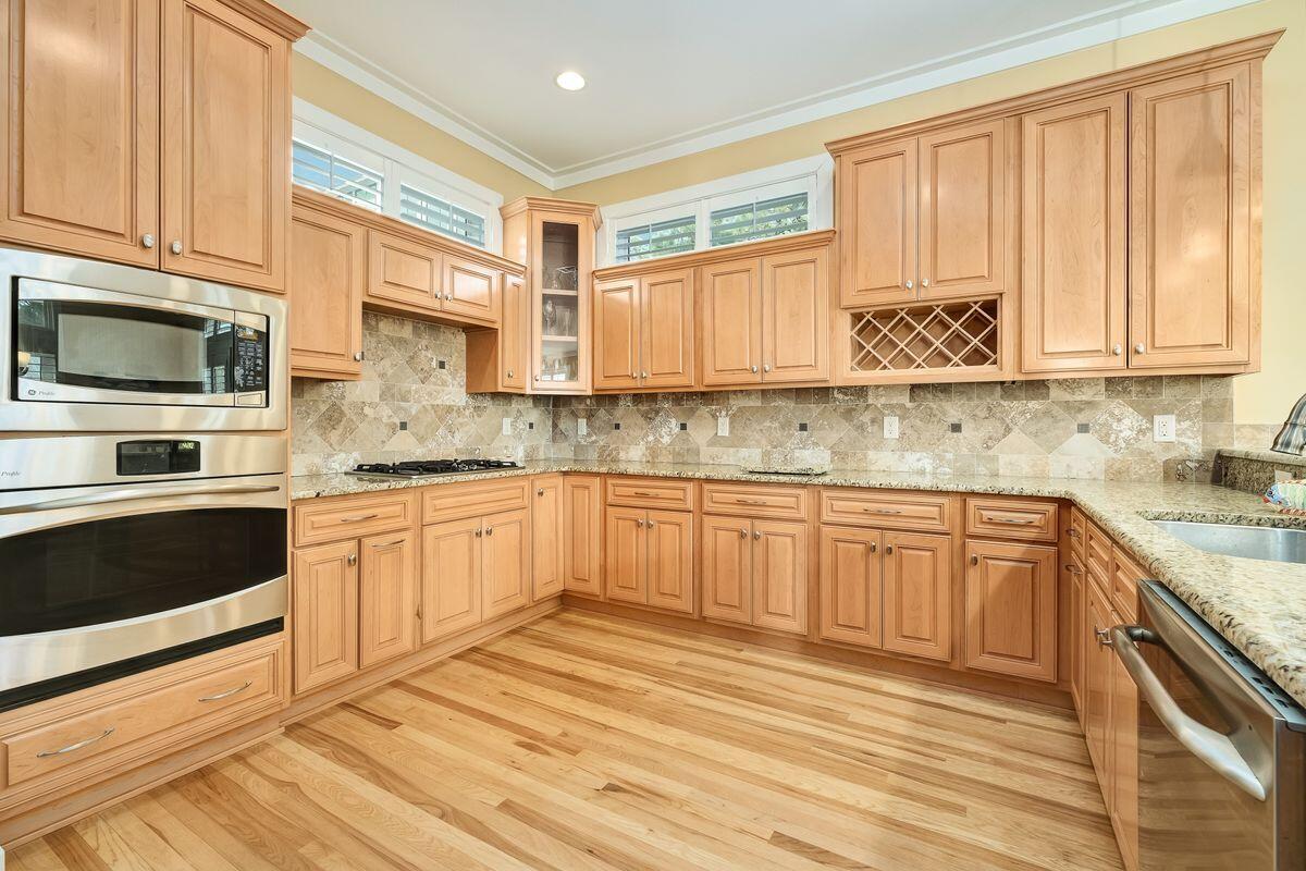 20 Sawgrass Lane Santa Rosa Beach, FL 32459 - Photo 6 of 25 a kitchen with stainless steel appliances granite countertop a stove a sink and a microwave