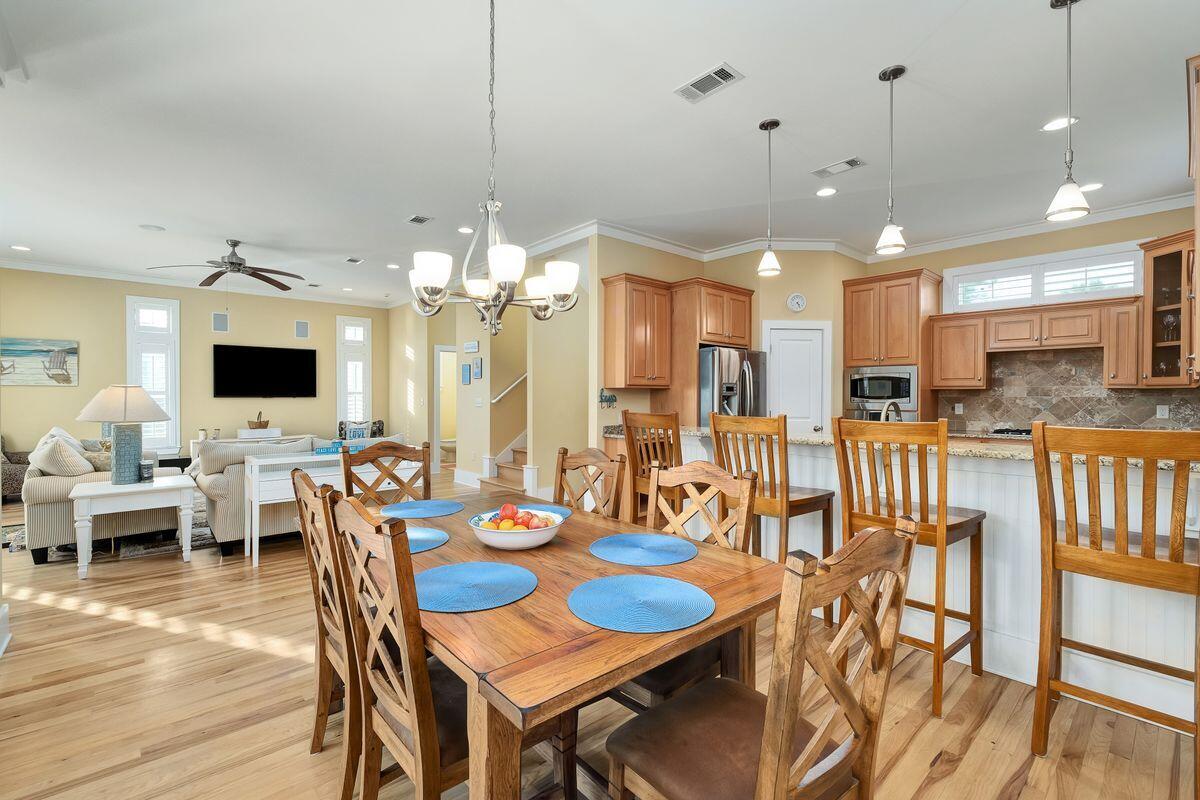 20 Sawgrass Lane Santa Rosa Beach, FL 32459 - Photo 8 of 25 a large kitchen with a table and chairs