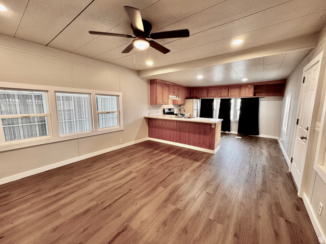 158 Cushing Way Layton, UT 84041 - Photo 3 of 14 Open-concept living space featuring wood-finish flooring, recessed lighting, and a ceiling fan