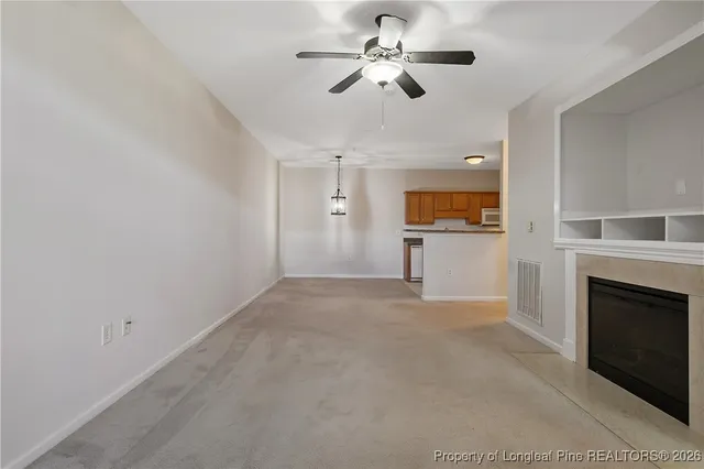 a view of a big room with carpet