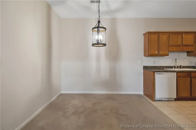 a view of a kitchen with a sink