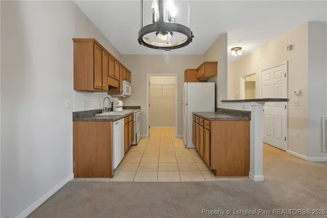 a view of a kitchen with a sink