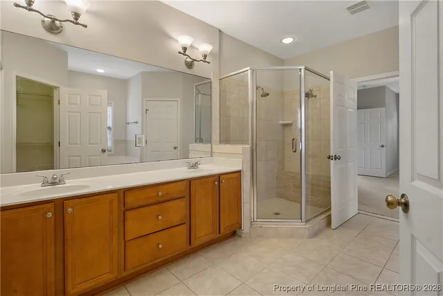 a bathroom with a shower and a sink
