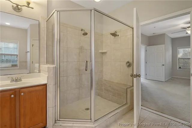 a bathroom with a bathtub a shower and a sink