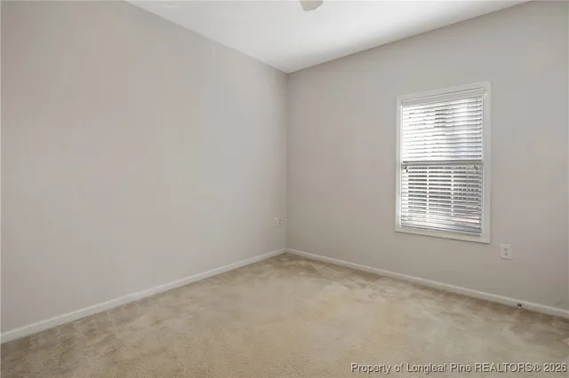 an empty room with a bathroom