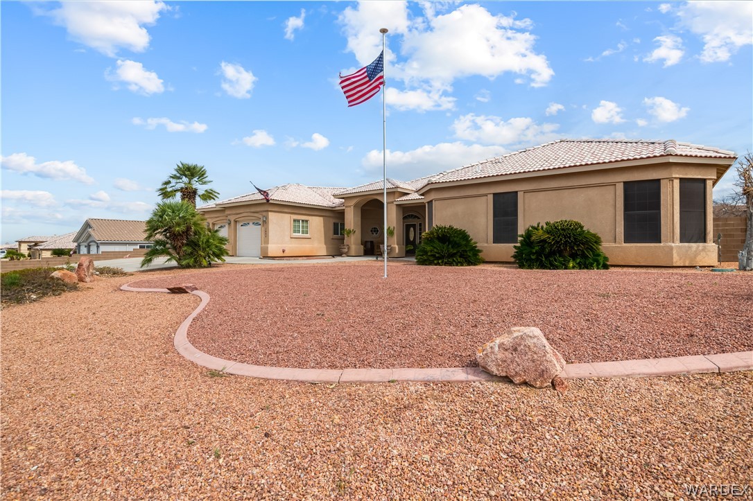 2898 Mountain Trail Road Kingman, AZ 86401 - Photo 35 of 75 a view of a house with a yard