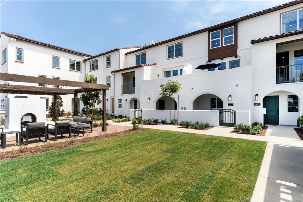 1479 Azalea Circle Gardena, CA 90247 - Photo 1 of 33 a group of people sitting in front of a house