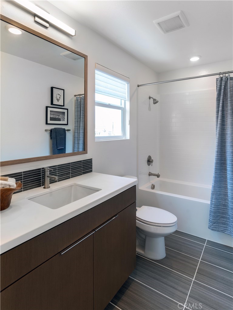 1479 Azalea Circle Gardena, CA 90247 - Photo 30 of 33 a bathroom with a sink toilet a mirror and shower