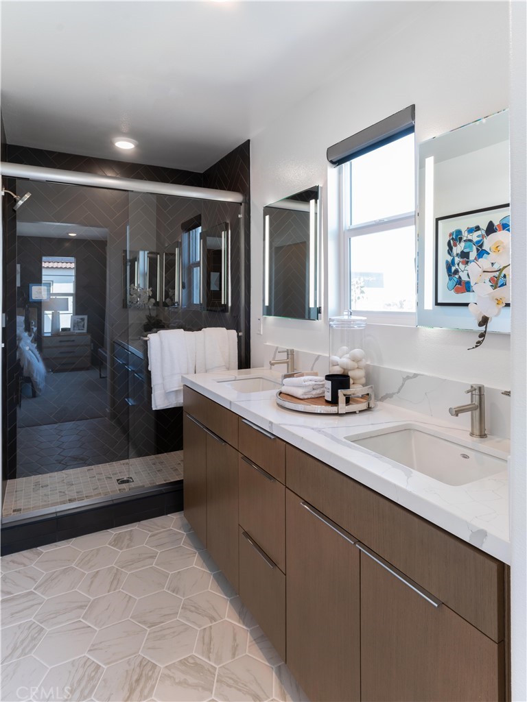 1479 Azalea Circle Gardena, CA 90247 - Photo 31 of 33 a bathroom with a sink a large mirror and a bathtub