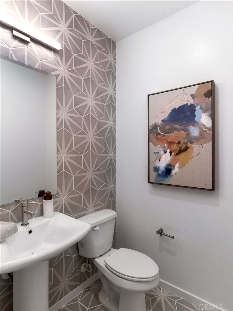 1479 Azalea Circle Gardena, CA 90247 - Photo 32 of 33 a bathroom with a toilet a sink and mirror