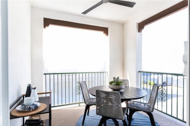 a view of a room with a table and chairs