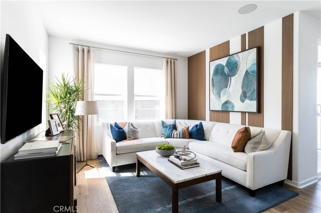 1479 Azalea Circle Gardena, CA 90247 - Photo 5 of 33 a living room with furniture a flat screen tv and a large window