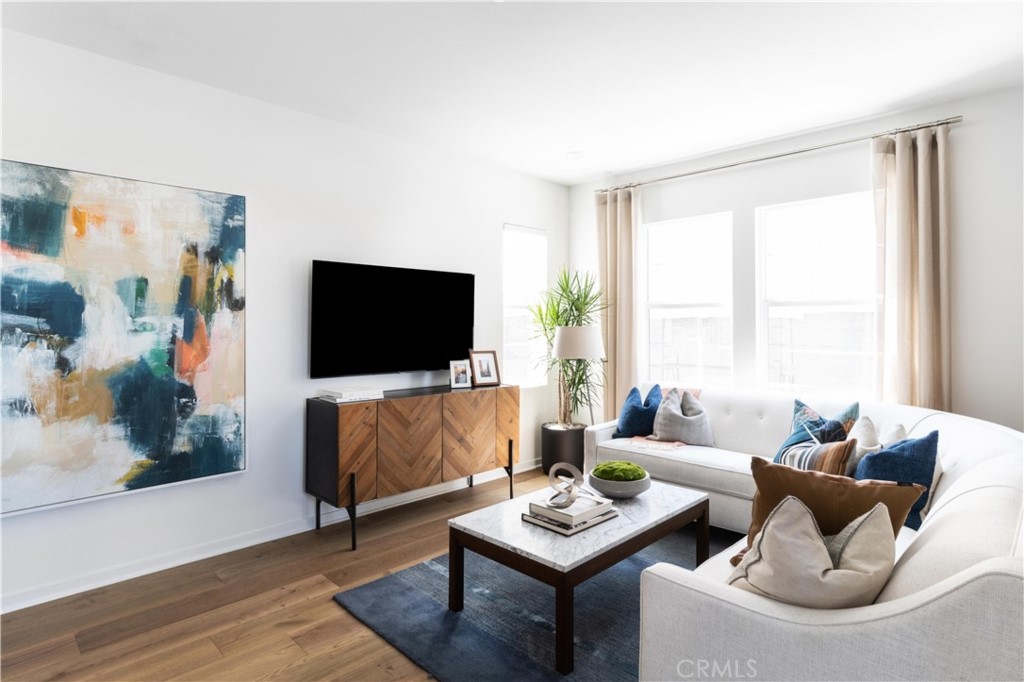 1479 Azalea Circle Gardena, CA 90247 - Photo 7 of 33 a living room with furniture and a flat screen tv