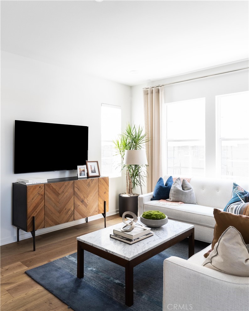 1479 Azalea Circle Gardena, CA 90247 - Photo 8 of 33 a living room with furniture and a flat screen tv