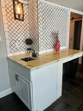 a view of a living room and kitchen