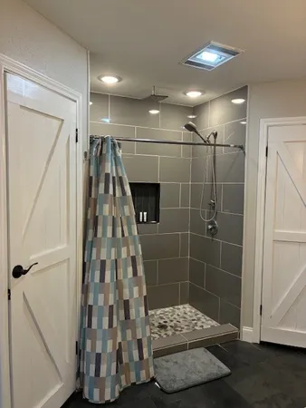 a bathroom with a double vanity sink and mirror