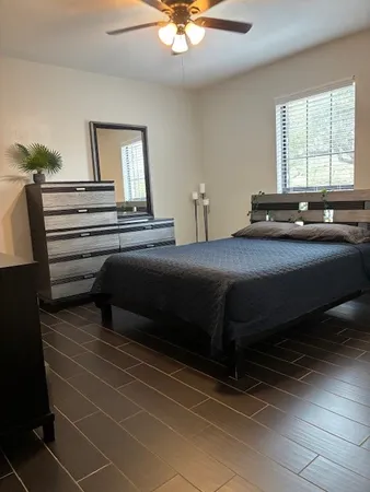 a bedroom with a bed and window