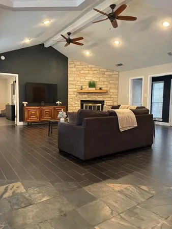 a living room with furniture and a flat screen tv
