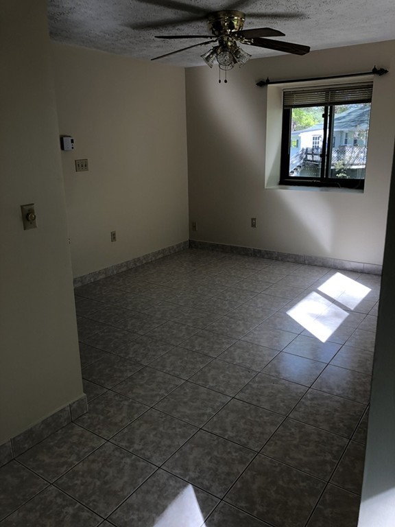 11 R Gamache Road, Unit 11R Derry, NH 03038 - Photo 18 of 20 en empty room with windows