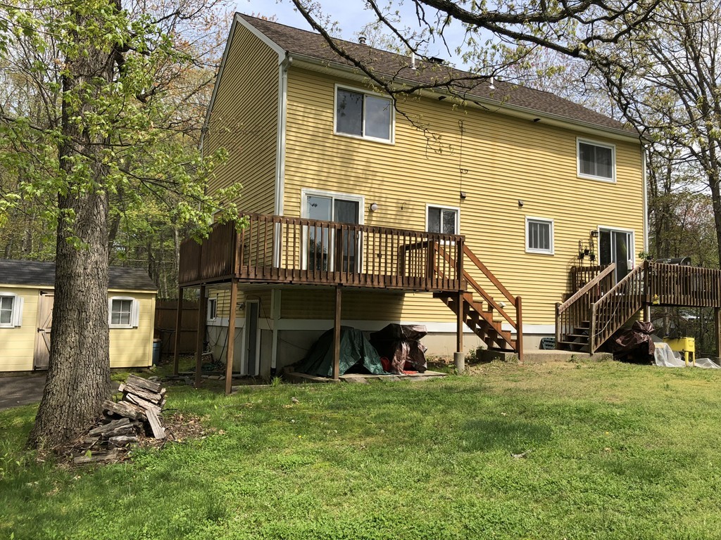 11 R Gamache Road, Unit 11R Derry, NH 03038 - Photo 3 of 20 a view of a house with a yard and sitting area