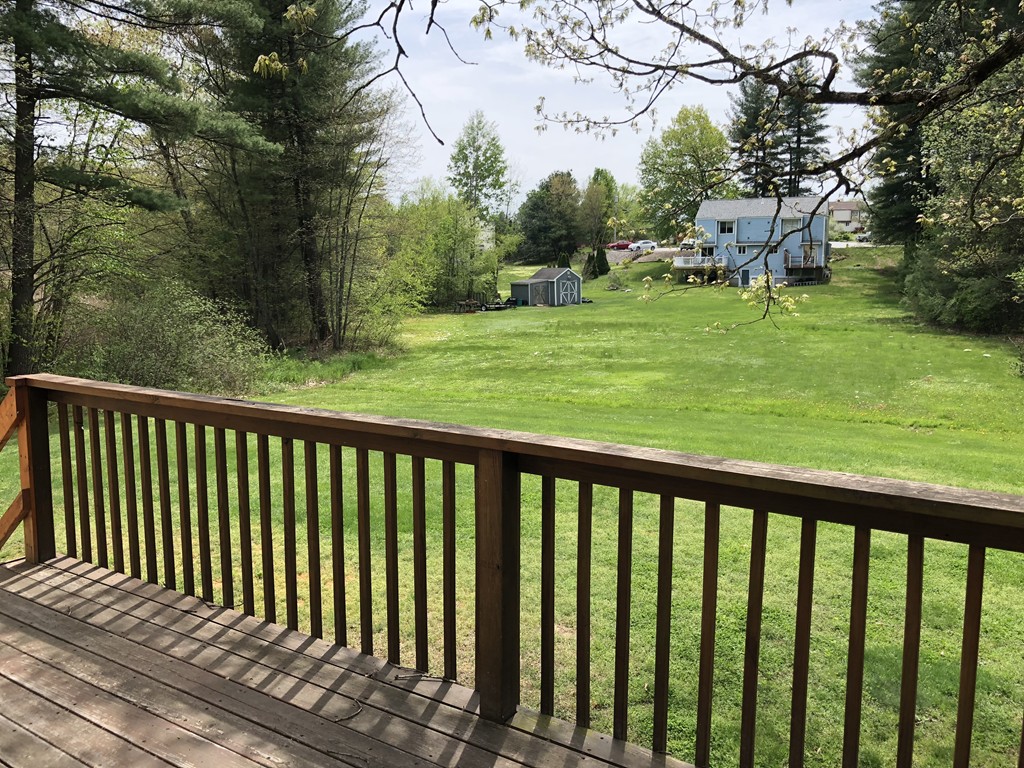 11 R Gamache Road, Unit 11R Derry, NH 03038 - Photo 4 of 20 a balcony with trees in front of it