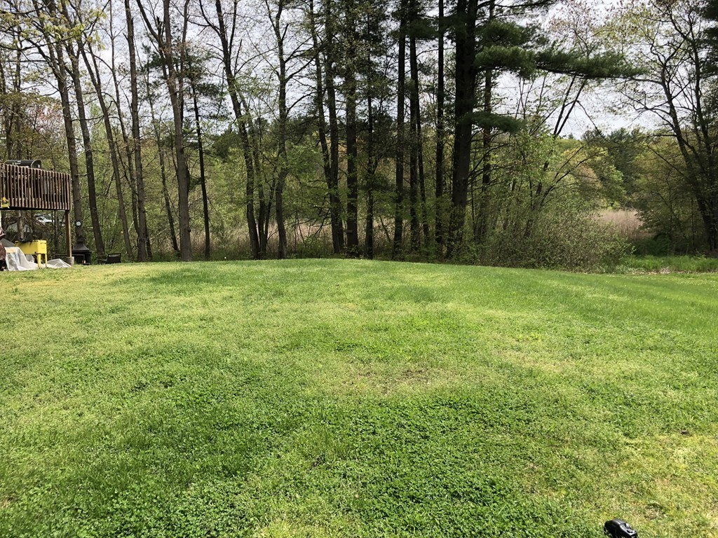 11 R Gamache Road, Unit 11R Derry, NH 03038 - Photo 6 of 20 a view of a field with trees in the background