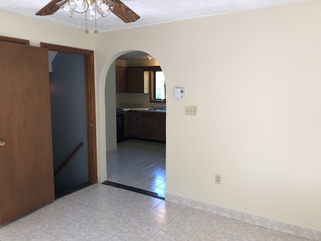 11 R Gamache Road, Unit 11R Derry, NH 03038 - Photo 10 of 20 a view of a hallway view with wooden floor and staircase