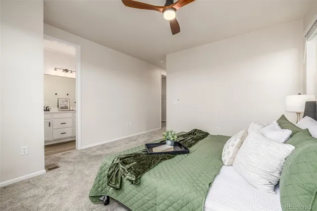 a bedroom with a bed and a cabinet