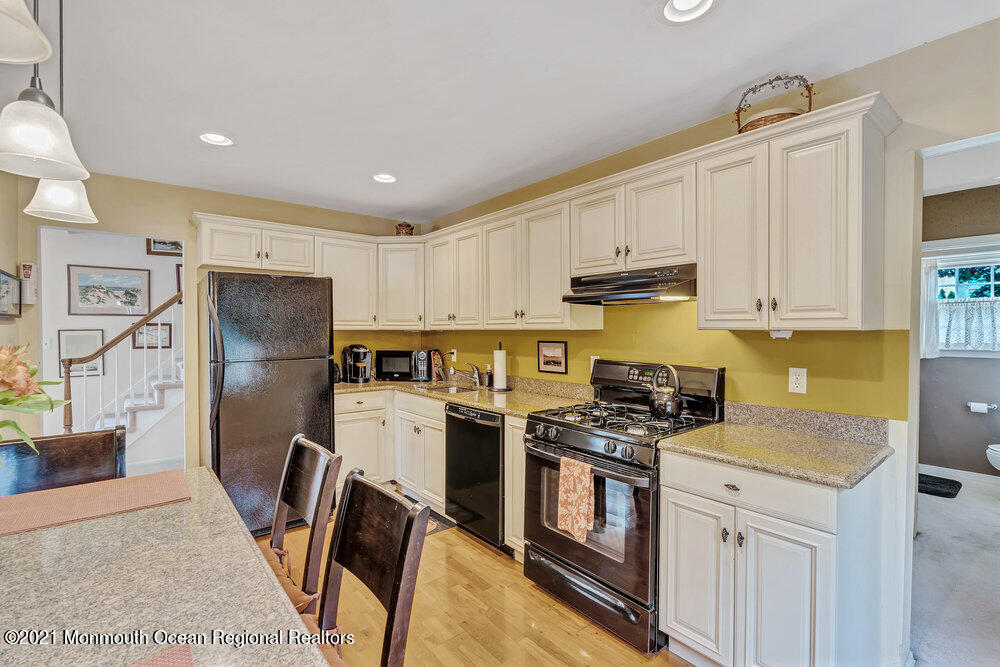 24 Limerick Place Hazlet, NJ 07730 - Photo 14 of 36 a kitchen with stainless steel appliances granite countertop a refrigerator stove microwave and sink