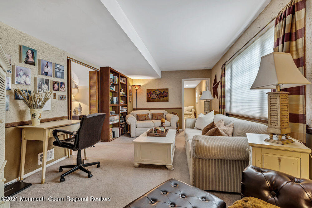 24 Limerick Place Hazlet, NJ 07730 - Photo 17 of 36 a living room with furniture and a flat screen tv