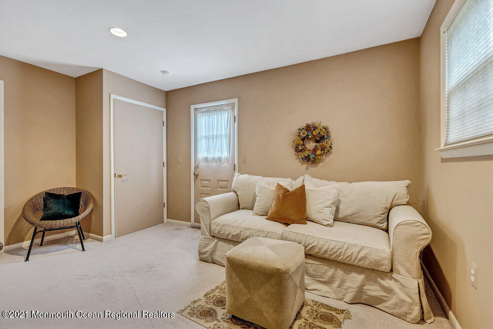 24 Limerick Place Hazlet, NJ 07730 - Photo 20 of 36 a living room with a couch and a chair