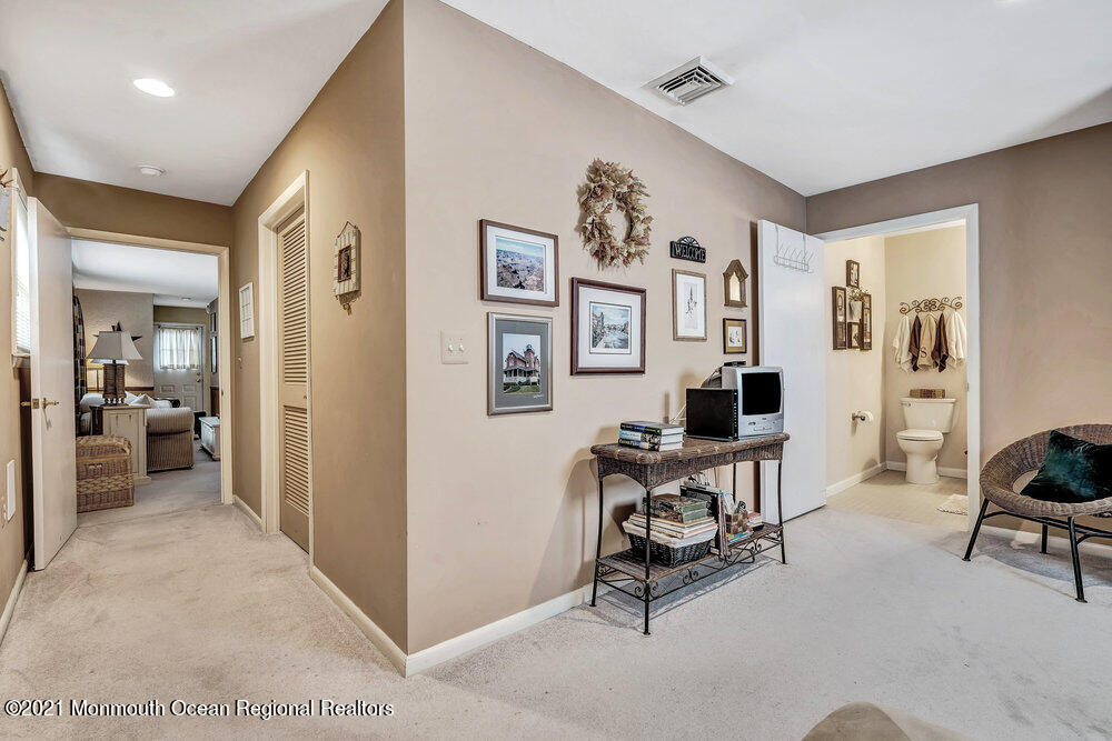 24 Limerick Place Hazlet, NJ 07730 - Photo 22 of 36 a view of a livingroom with workspace and a couch