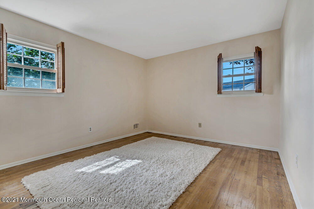 24 Limerick Place Hazlet, NJ 07730 - Photo 25 of 36 a view of a room with wooden floor and window