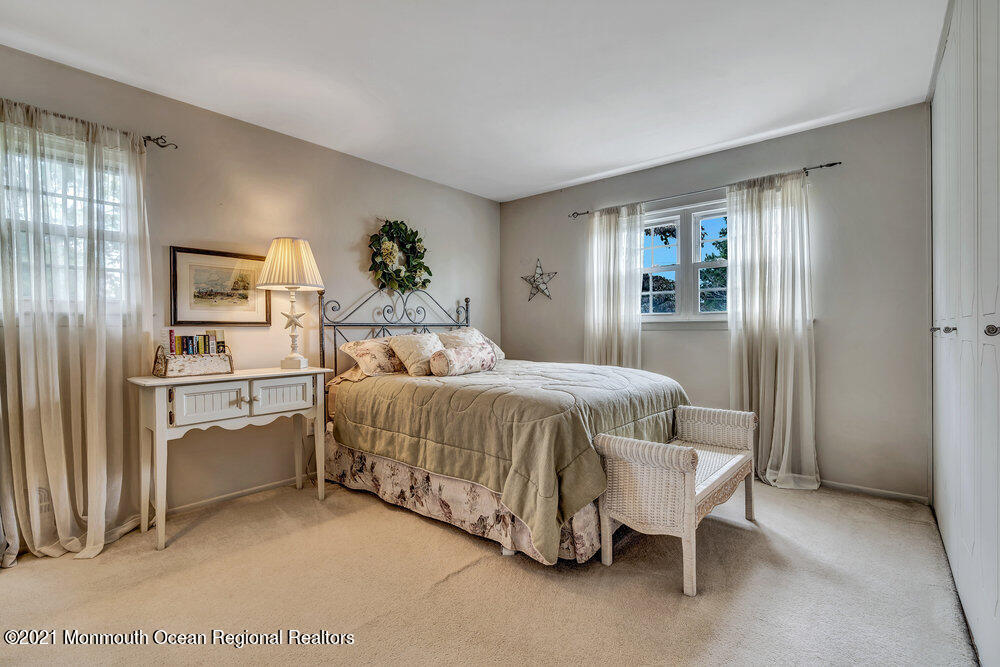 24 Limerick Place Hazlet, NJ 07730 - Photo 29 of 36 a bedroom with a bed and a window