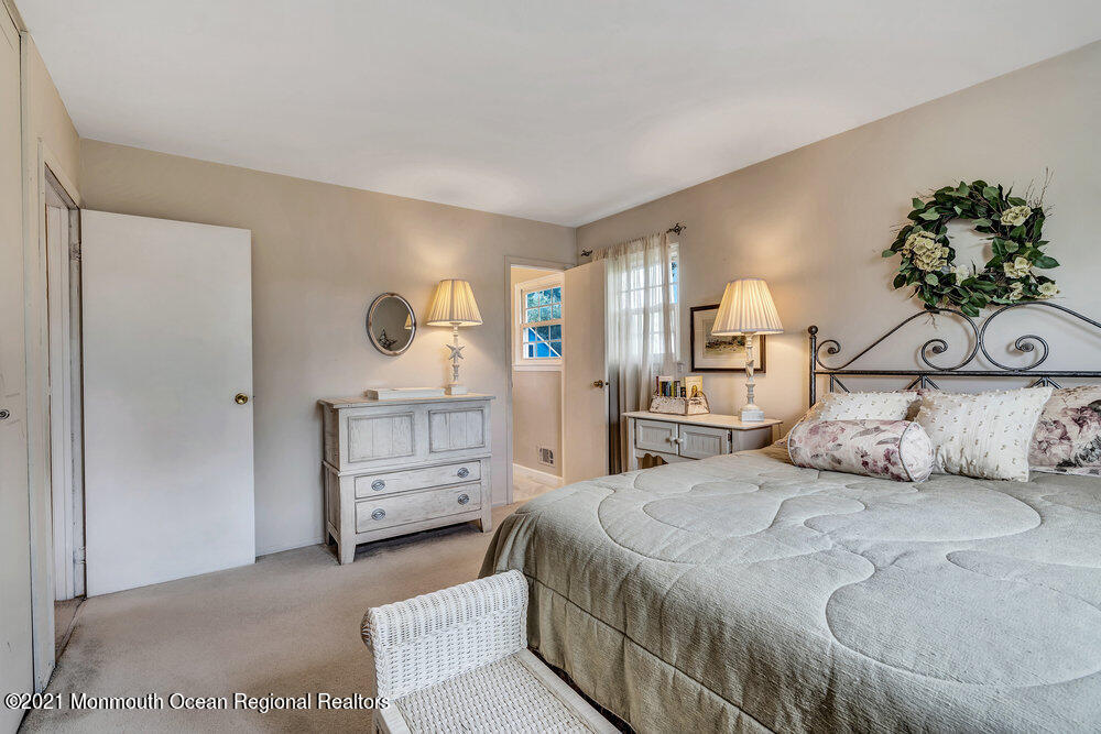 24 Limerick Place Hazlet, NJ 07730 - Photo 30 of 36 a bedroom with a bed and a dresser