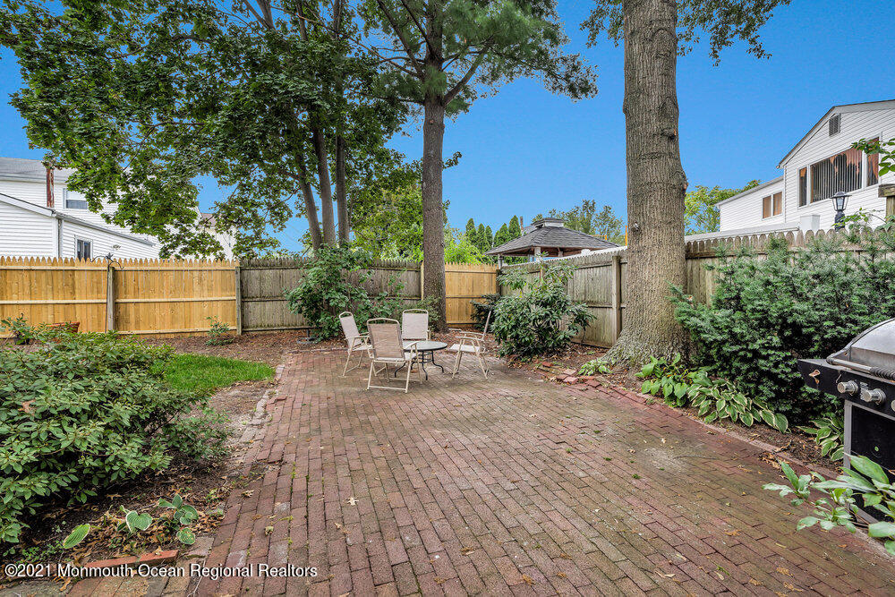 24 Limerick Place Hazlet, NJ 07730 - Photo 34 of 36 a view of a backyard with sitting area