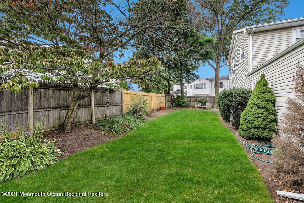 24 Limerick Place Hazlet, NJ 07730 - Photo 35 of 36 a view of a backyard with a garden
