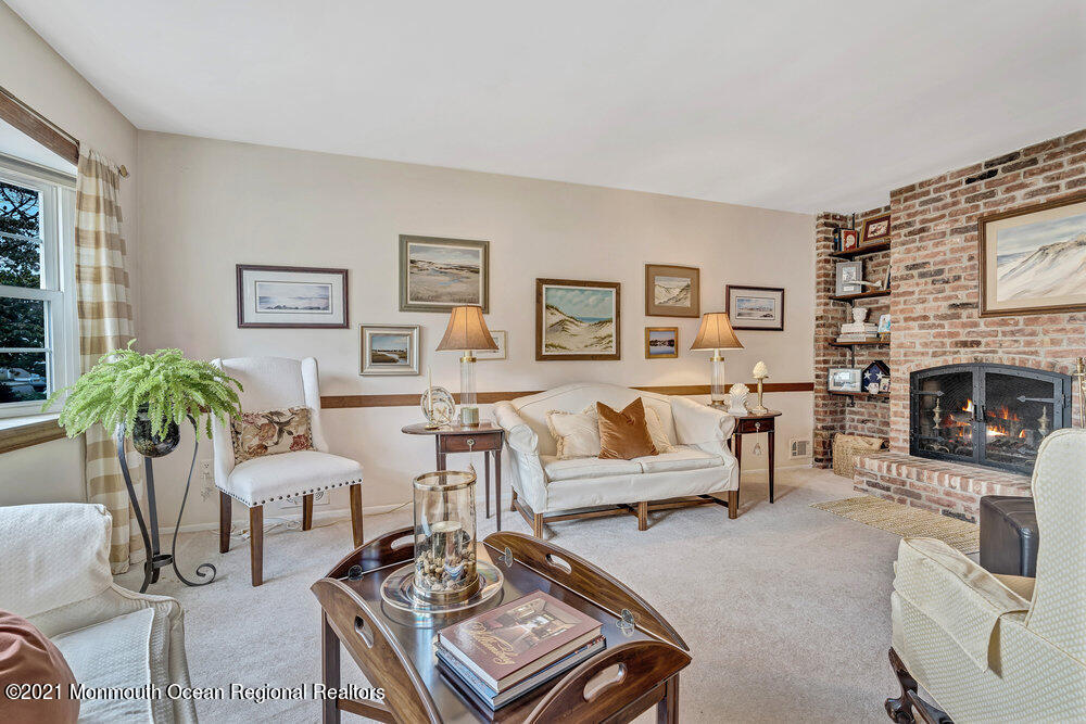 24 Limerick Place Hazlet, NJ 07730 - Photo 6 of 36 a living room with furniture and a fireplace