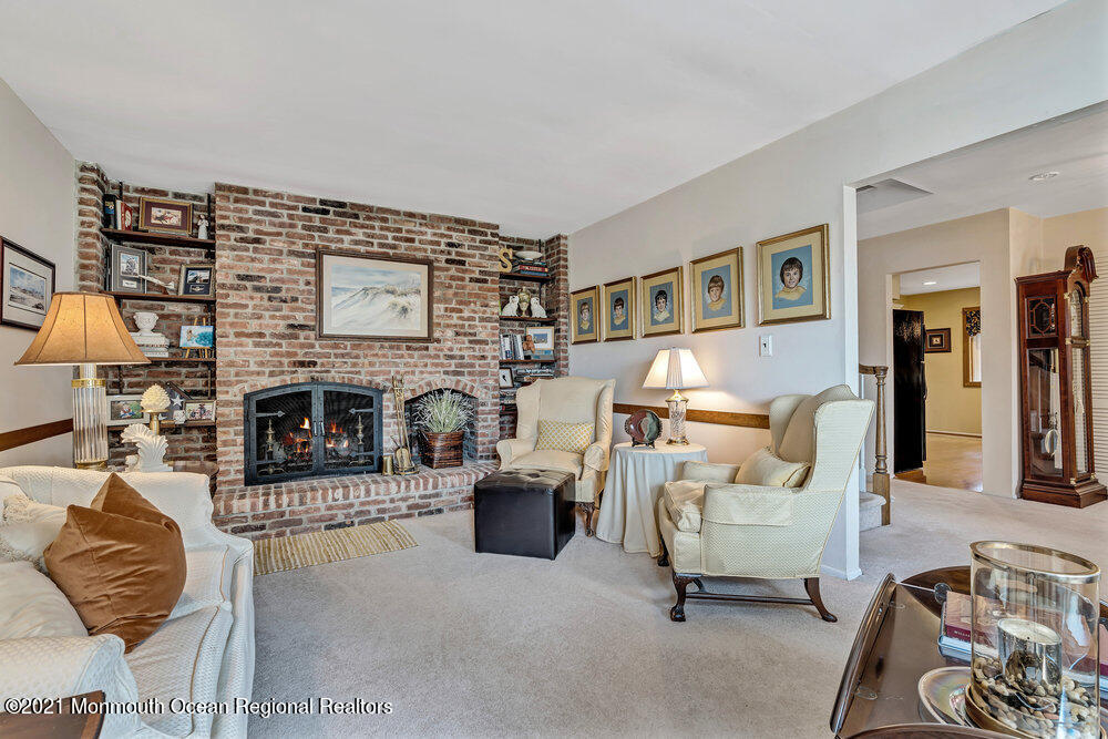 24 Limerick Place Hazlet, NJ 07730 - Photo 7 of 36 a living room with furniture and a fireplace