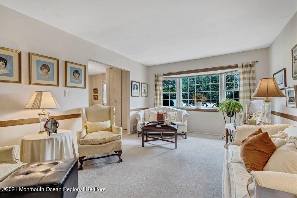 24 Limerick Place Hazlet, NJ 07730 - Photo 8 of 36 a living room with furniture and a large window
