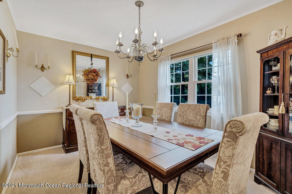 24 Limerick Place Hazlet, NJ 07730 - Photo 10 of 36 a view of a dining room with furniture window and wooden floor