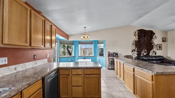 a kitchen with stainless steel appliances granite countertop a sink and cabinets