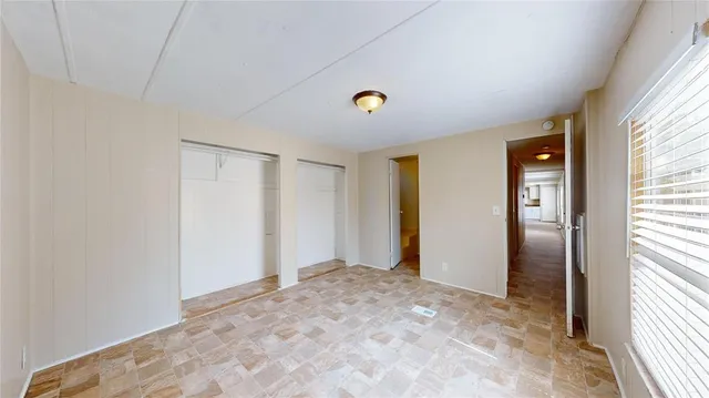 a view of an empty room and window