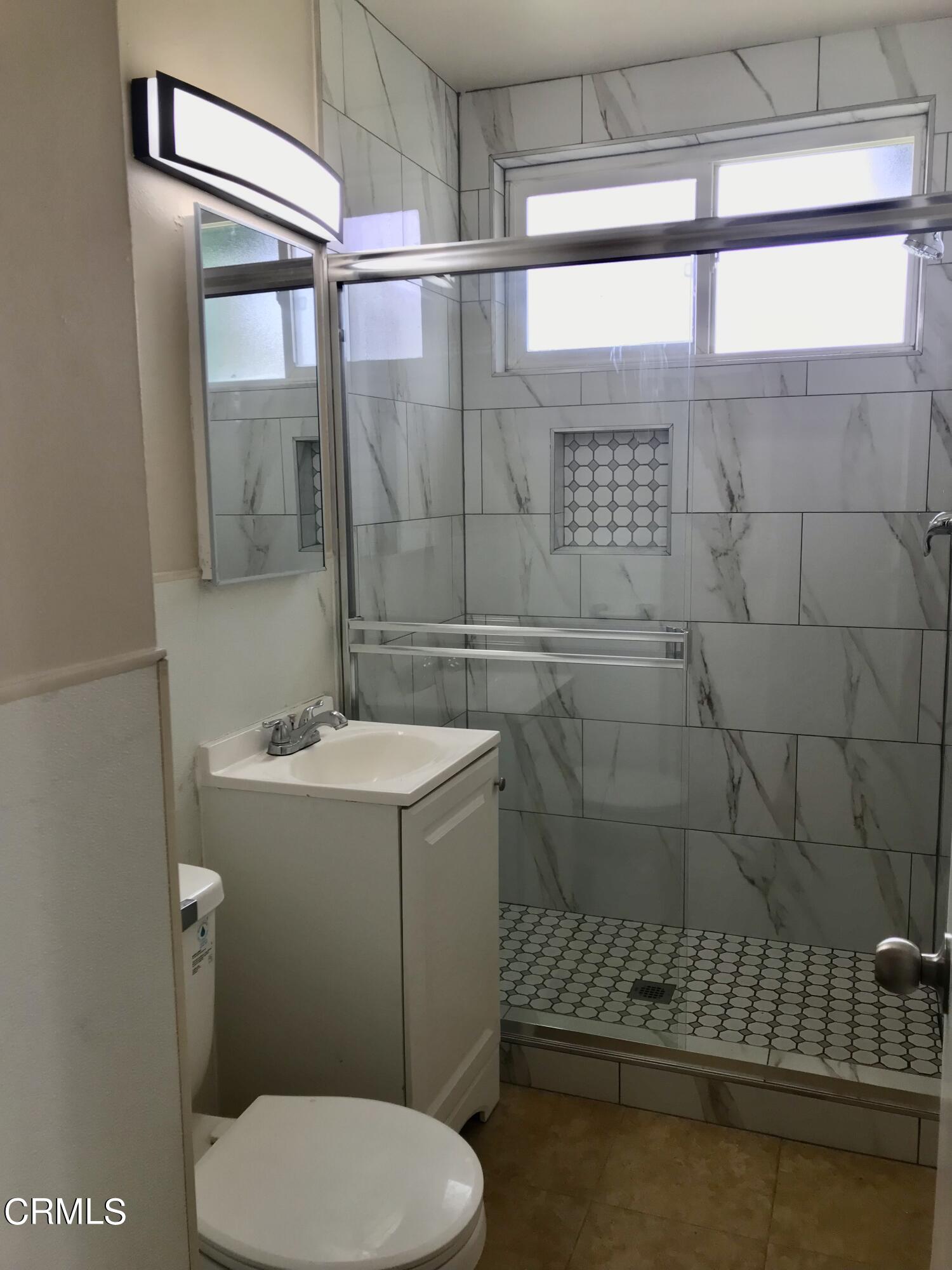 3148 Napa Street Oxnard, CA 93033 - Photo 12 of 15 a bathroom with a sink toilet and shower