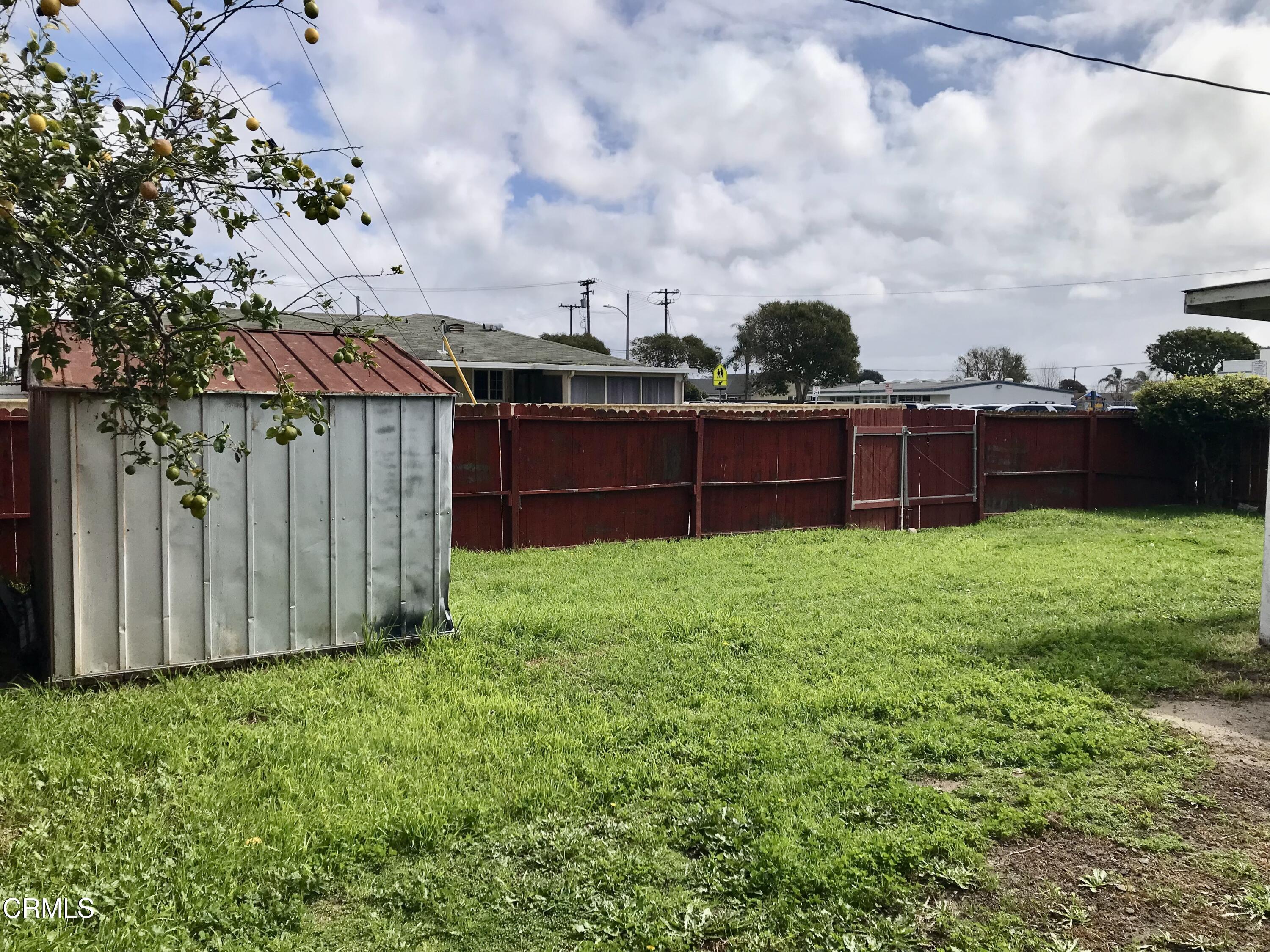 3148 Napa Street Oxnard, CA 93033 - Photo 15 of 15 a view of yard with green space and wooden fence