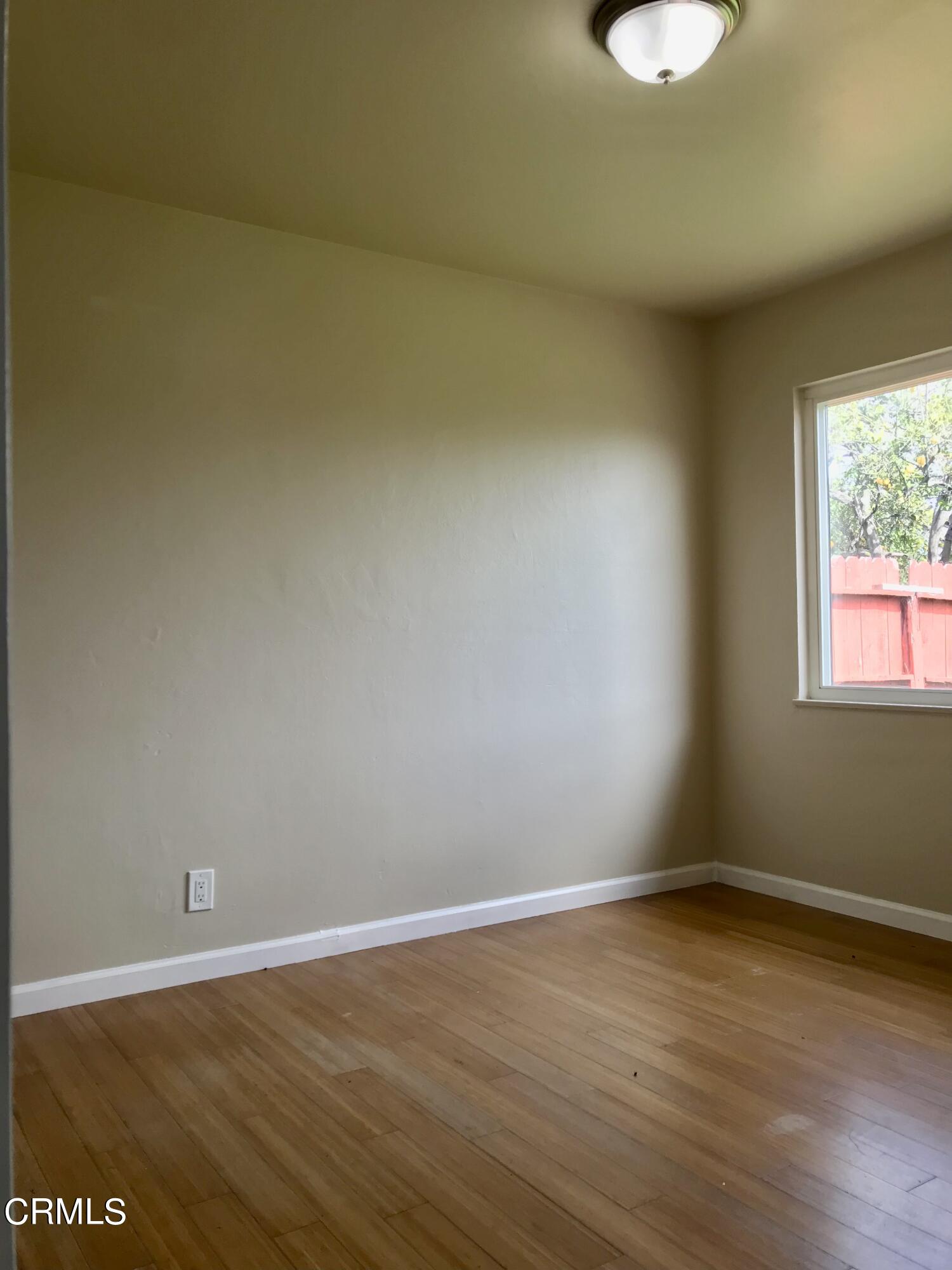 3148 Napa Street Oxnard, CA 93033 - Photo 10 of 15 a view of a room with wooden floor and window