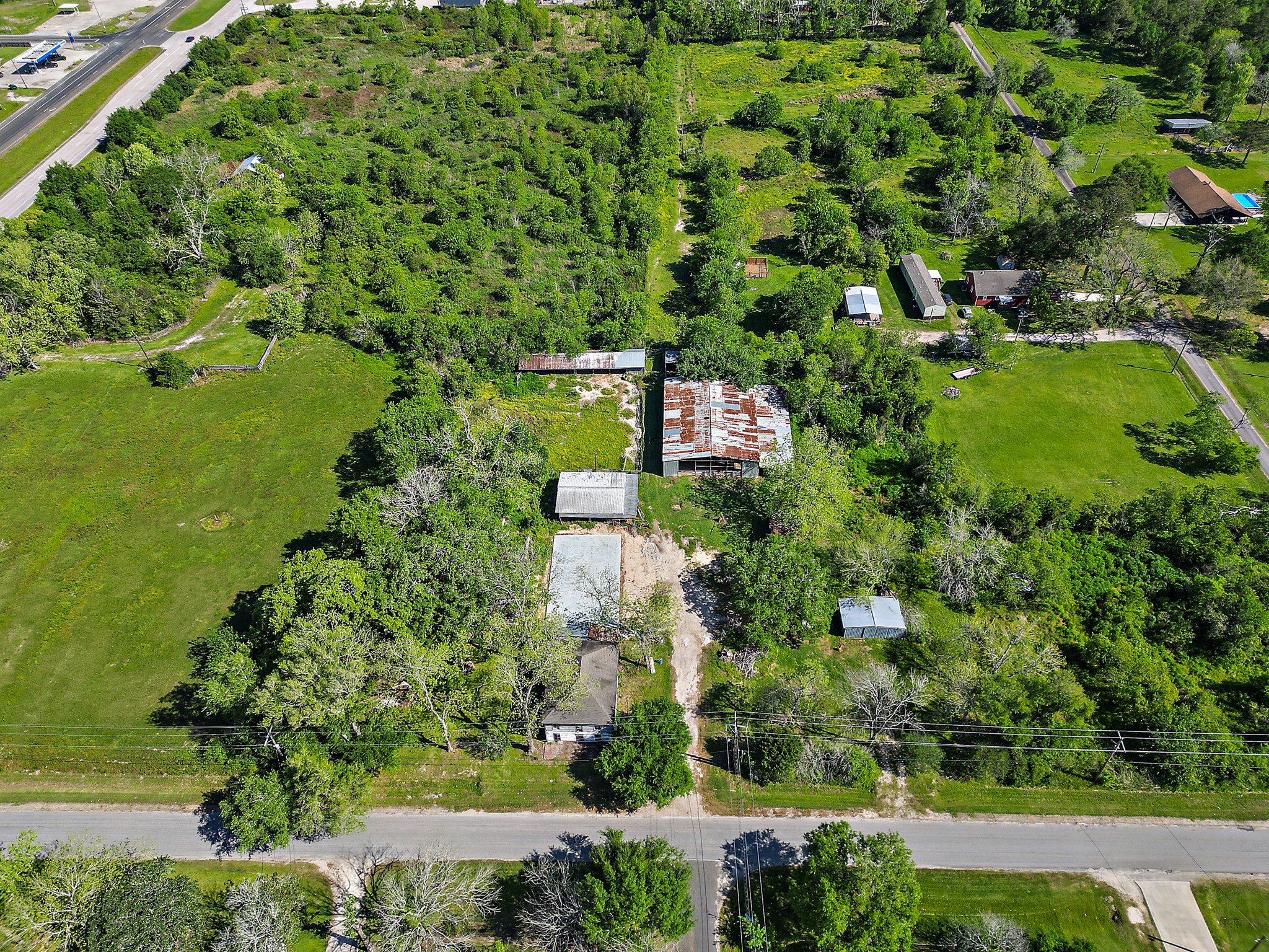 406 Main Street Winnie, TX 77665 - Photo 1 of 20 an aerial view of a residential houses with outdoor space and trees all around
