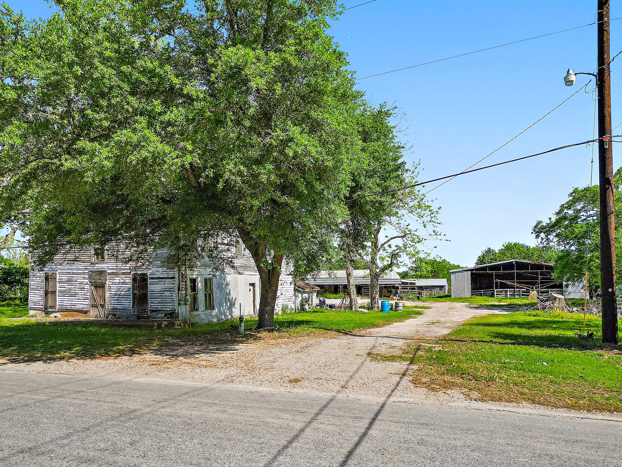 406 Main Street Winnie, TX 77665 - Photo 11 of 20 a front view of a house with a yard