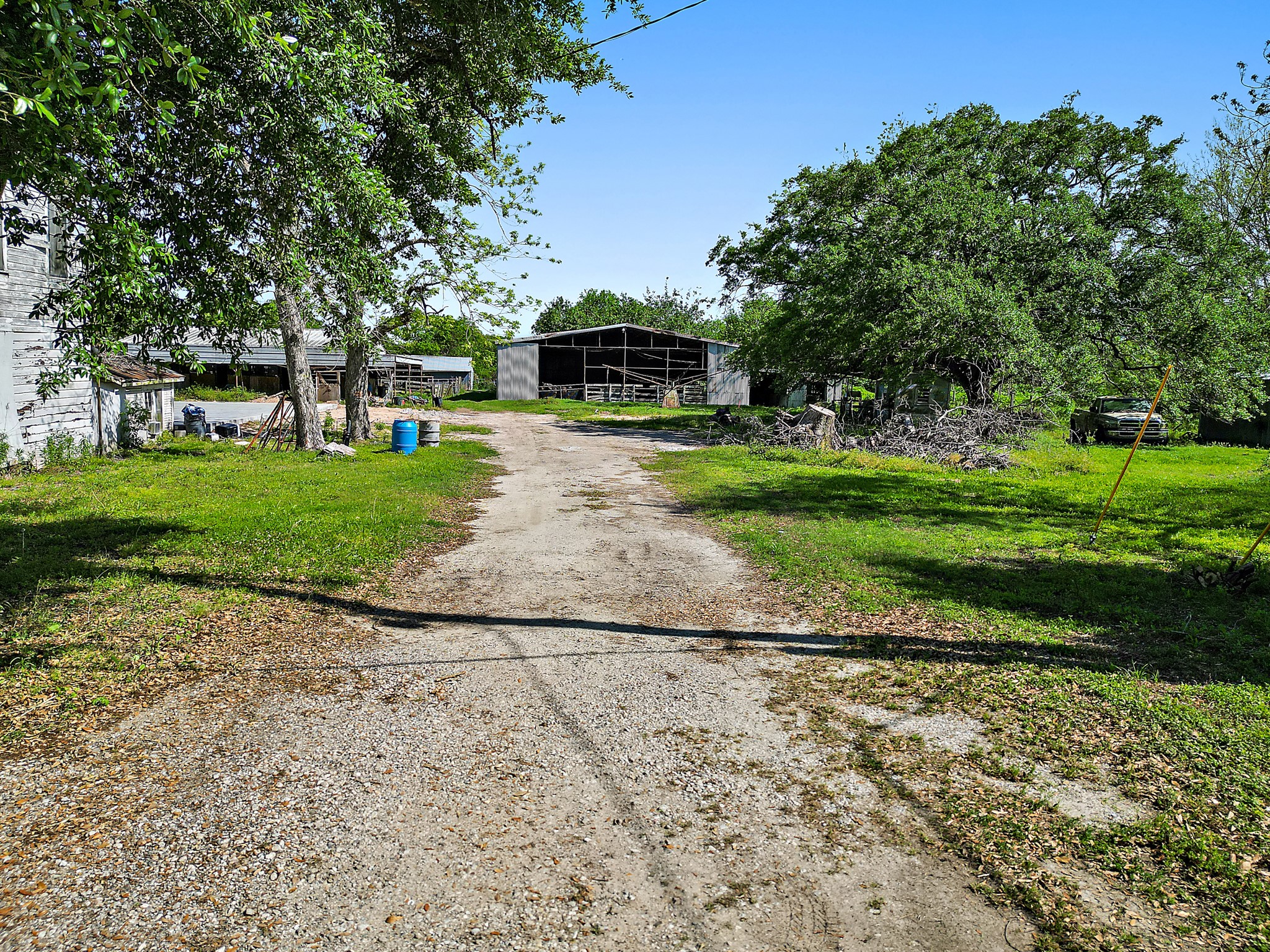 406 Main Street Winnie, TX 77665 - Photo 13 of 20 a front view of a house with a yard and a garage
