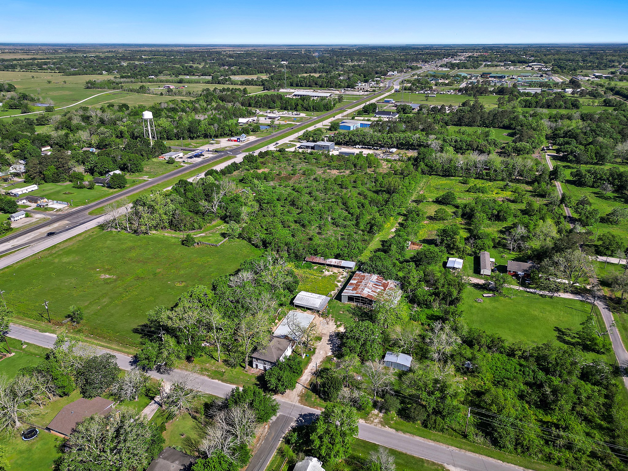 406 Main Street Winnie, TX 77665 - Photo 15 of 20 a view of a city with lush green forest